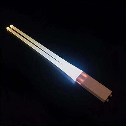 LED Lightsaber Chopsticks with bright blue illumination, perfect for adding a touch of Star Wars-inspired fun to any meal.