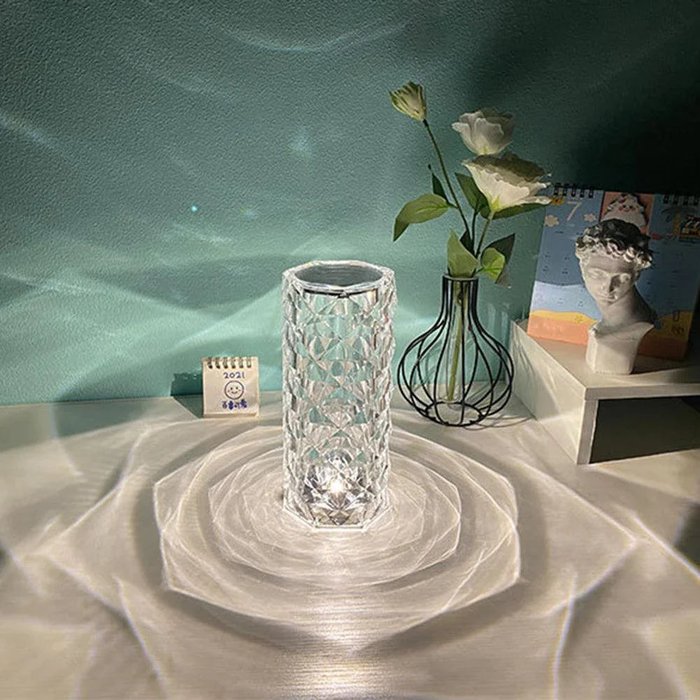 Elegant diamond-inspired crystal lamp with touch-sensitive dimming controls, providing adjustable ambient lighting for bedrooms and living spaces.