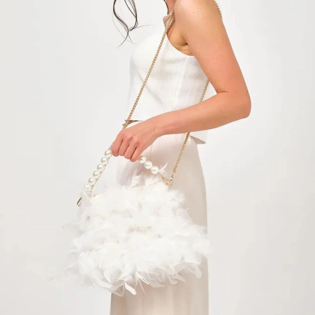Elegant feather clutch bag with pearl embellishments and metal chain details