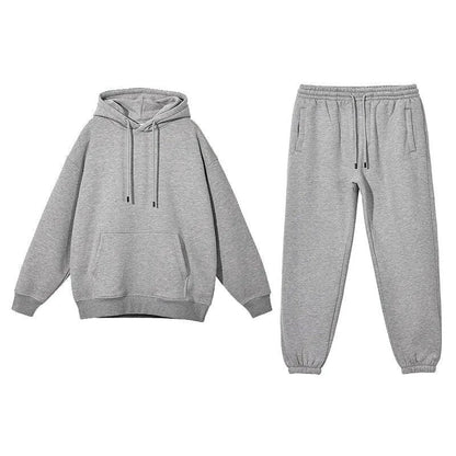 Cozy Fleece Hoodie and Sweatpants Set in Light Pink, featuring a relaxed fit and hooded design for maximum comfort and style.