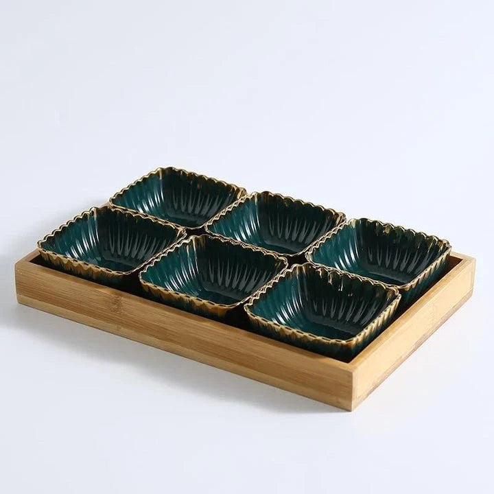 Elegant green and gold ceramic serving platter with a wood trim, perfect for hosting and elevating your dining experience.