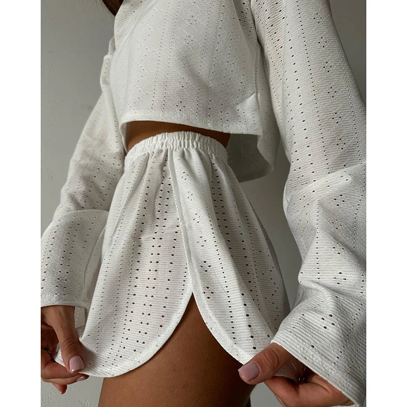 Trendha Women's Long Sleeve Pullover Top and Shorts Set in White, featuring a chic hollow-out design and flattering slim fit