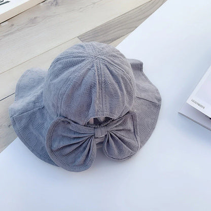 Adorable princess-inspired baby bucket hat with soft cotton material and wide brim for sun protection