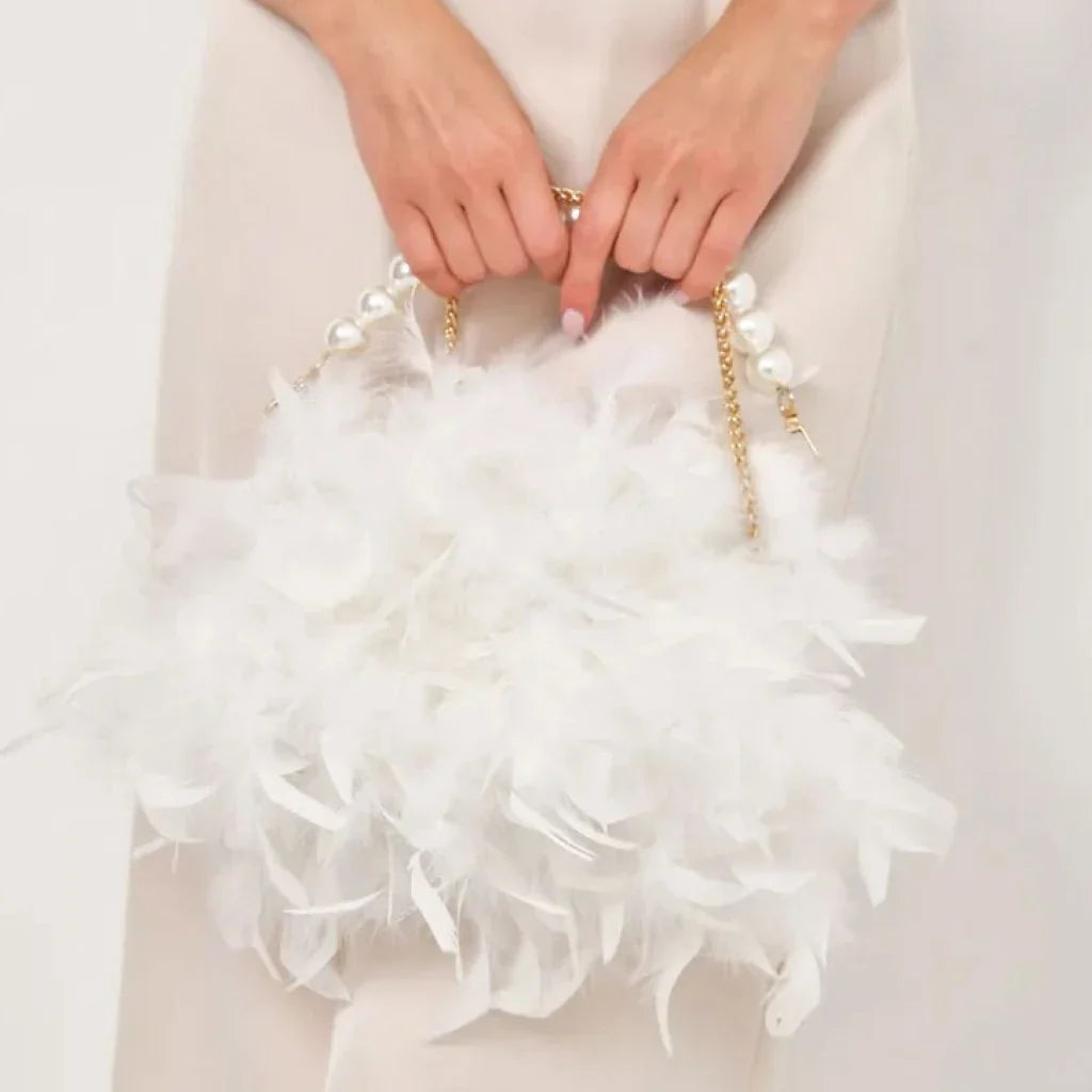 Elegant feather clutch bag with pearl embellishments and metal chain details