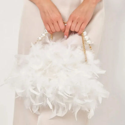 Elegant feather clutch bag with pearl embellishments and metal chain details