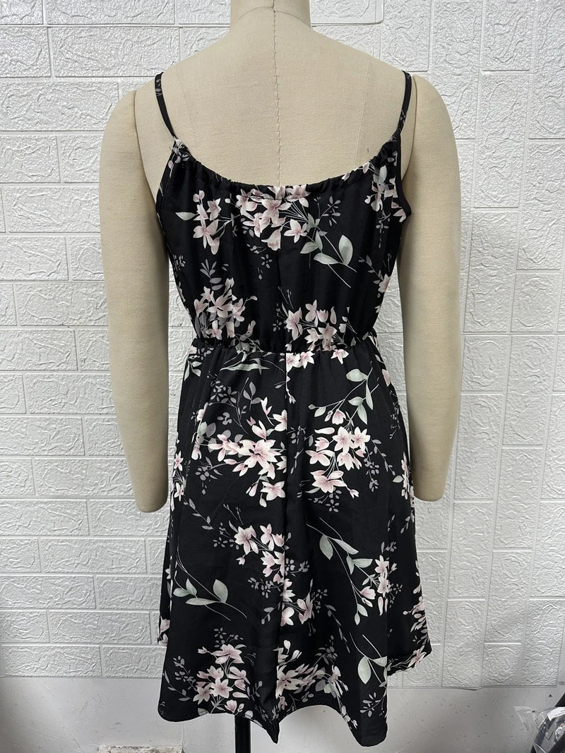 A stylish floral print suspender dress with an elastic waist, perfect for summer fashion and casual or dressy occasions.