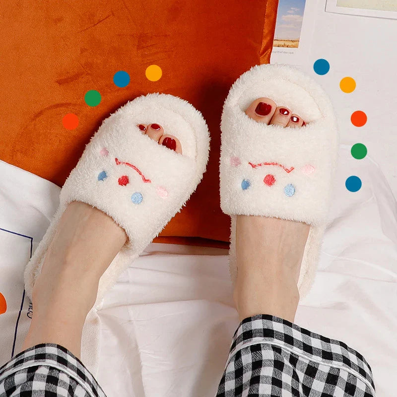 Cozy plush slippers with a smiling face design for comfortable indoor wear
