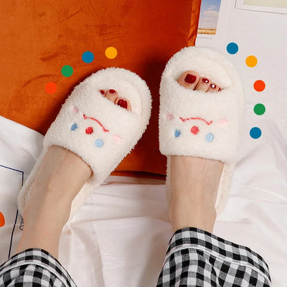 Cozy plush slippers with a smiling face design for comfortable indoor wear
