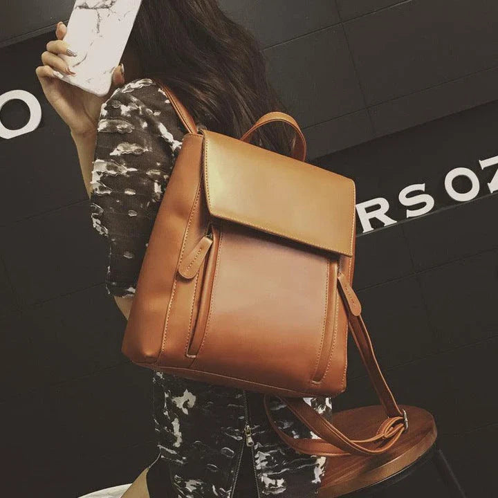 Versatile British-inspired shoulder bag made from high-quality PU leather with a spacious main compartment, convenient pockets, and an adjustable strap