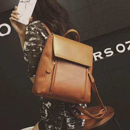 Versatile British-inspired shoulder bag made from high-quality PU leather with a spacious main compartment, convenient pockets, and an adjustable strap