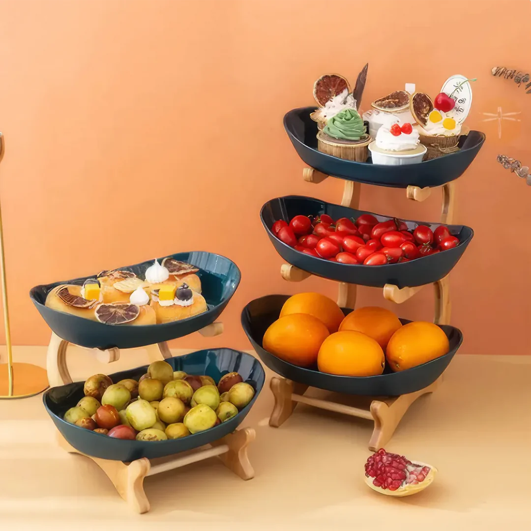 Three-tier plastic and bamboo fruit display tray with unique leaf-shaped design, available in white, beige, and green colors