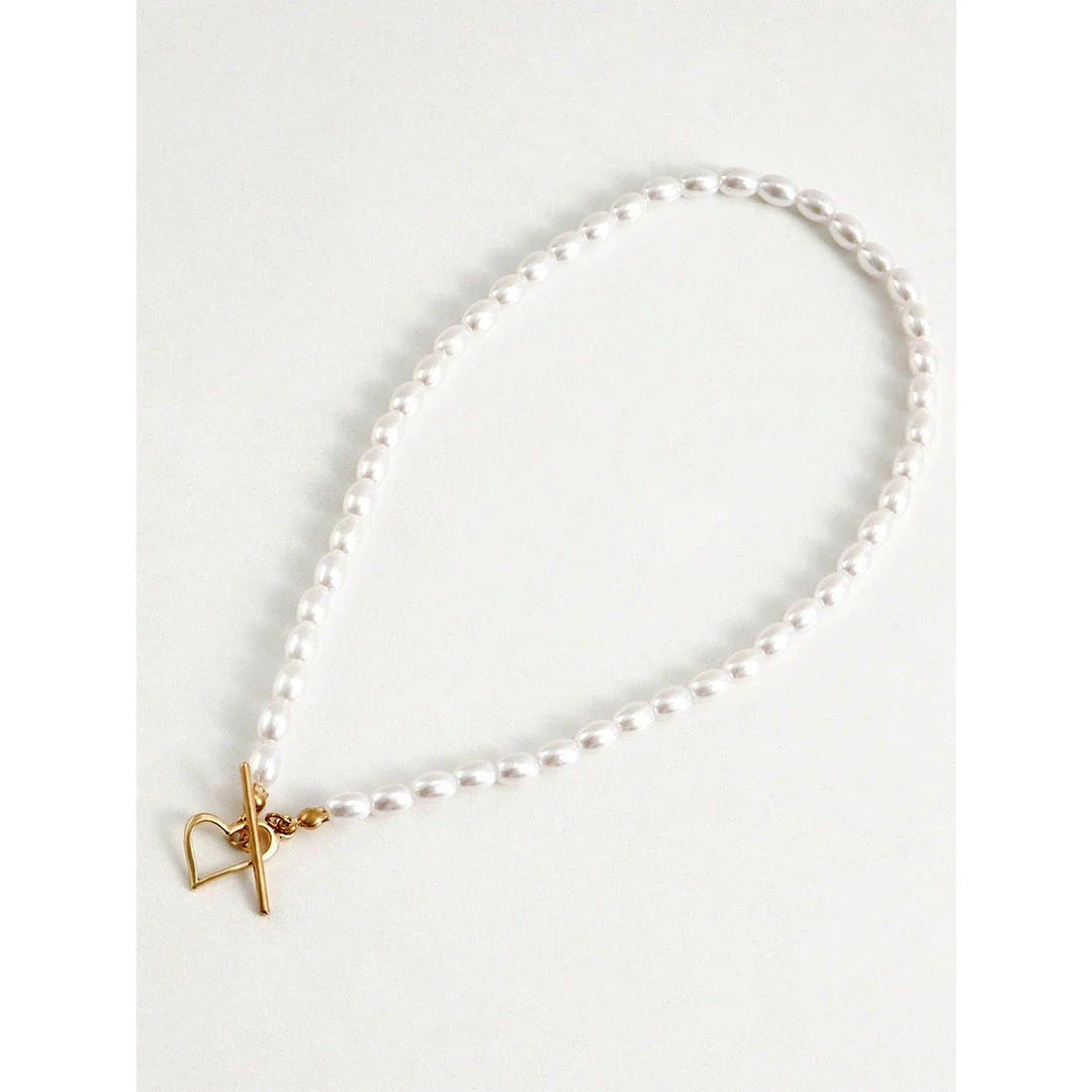 Elegant imitation pearl heart pendant necklace with lustrous bead chain and secure closure