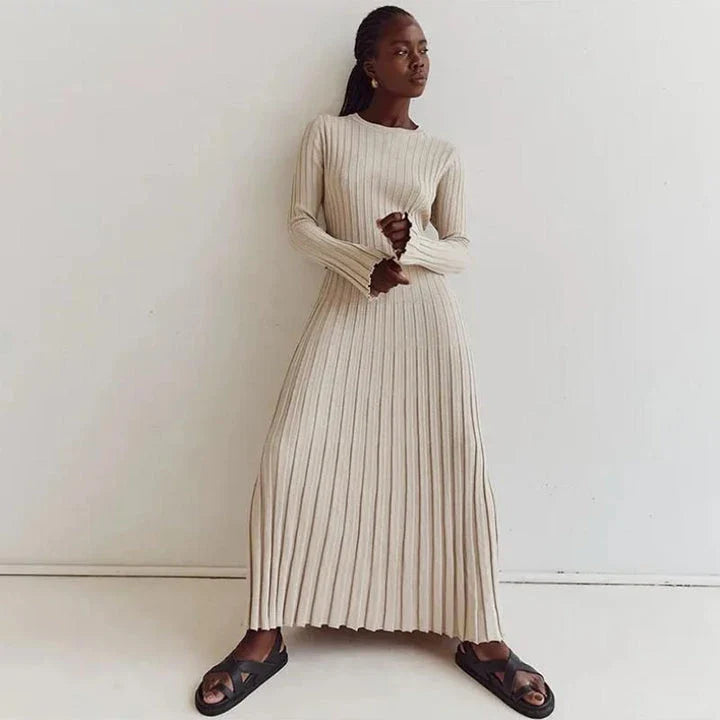 Timeless elegant pleated knit dress in black, perfect for summer office wear with a sophisticated and comfortable design.