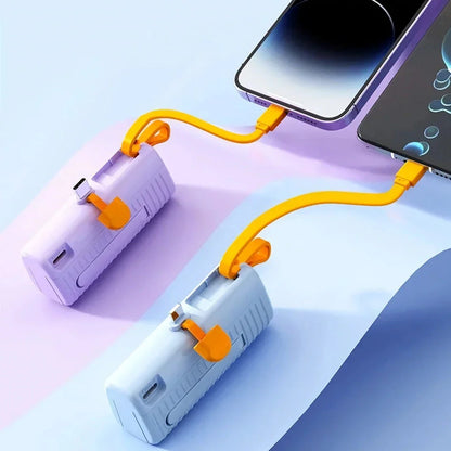 A compact, dual-port 30,000mAh power bank with built-in charging cables and fast charging capabilities.