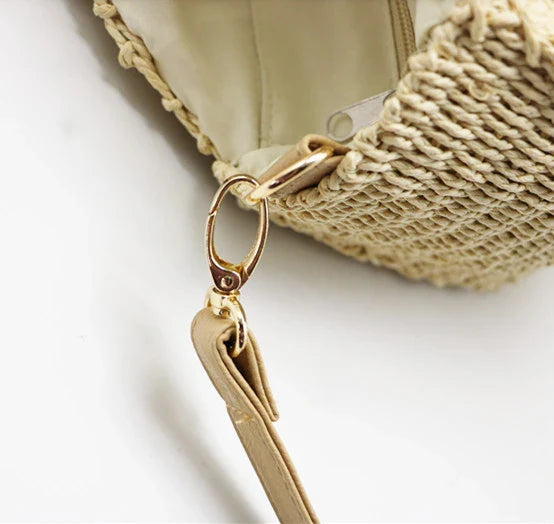 Stylish round straw woven handbag with zipper closure and comfortable carrying handle