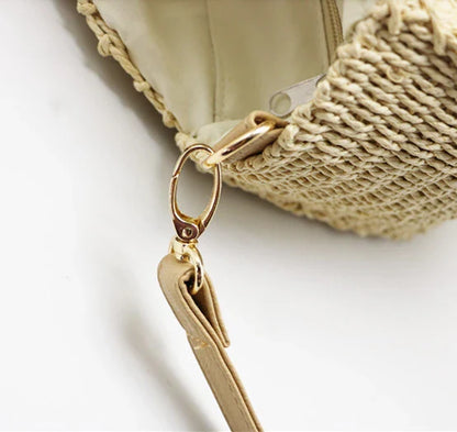 Stylish round straw woven handbag with zipper closure and comfortable carrying handle