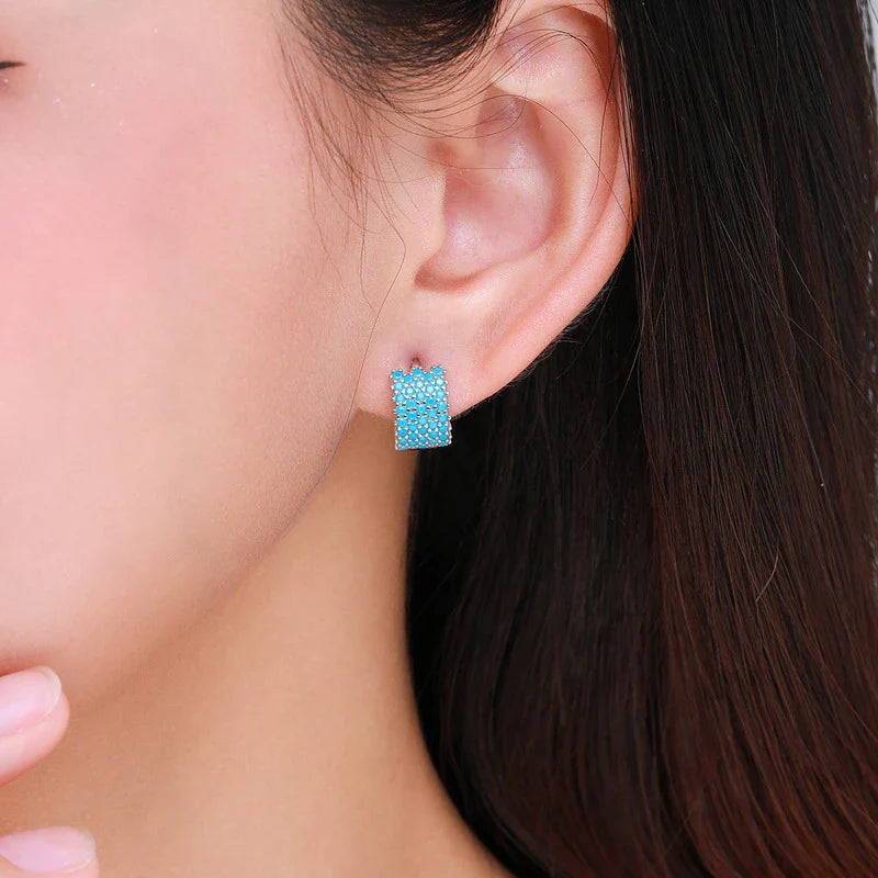Pair of elegant silver hoop earrings with a micro-insert design, perfect for adding a touch of sophistication to any outfit.