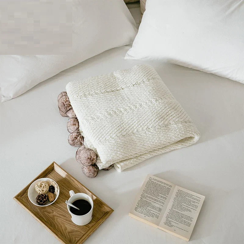 Cozy chenille ball-knit wool blanket in pink, gray, and white colors