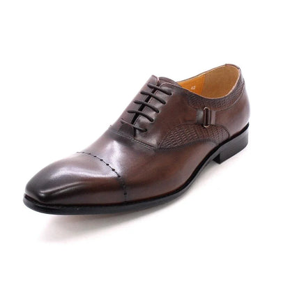 Premium handcrafted leather oxfords in brown with a pointed toe design, suitable for business and formal occasions.