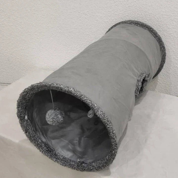 A cozy and collapsible cat tunnel toy made of high-quality polyester material, providing a warm and durable hideaway for indoor playtime and relaxation.