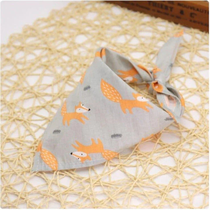 Adorable Cartoon Patterned Triangular Dog Scarf in vibrant colors, perfect for keeping your pup warm and stylish