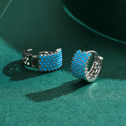Pair of elegant silver hoop earrings with a micro-insert design, perfect for adding a touch of sophistication to any outfit.