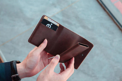 Stylish men's tri-fold wallet made of premium PU leather with magnetic buckle closure and multiple compartments for organization