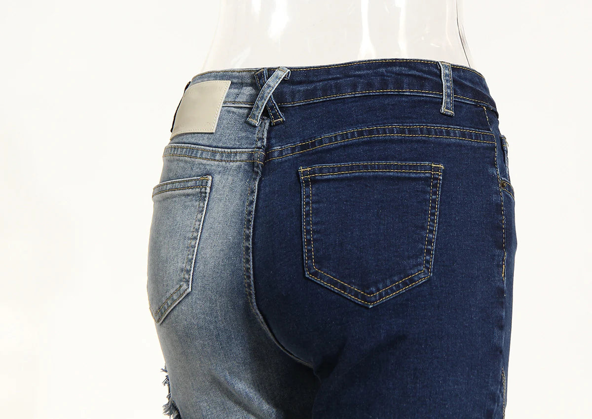 Geometric raw edge jeans with high-waisted, slimming design in blue denim