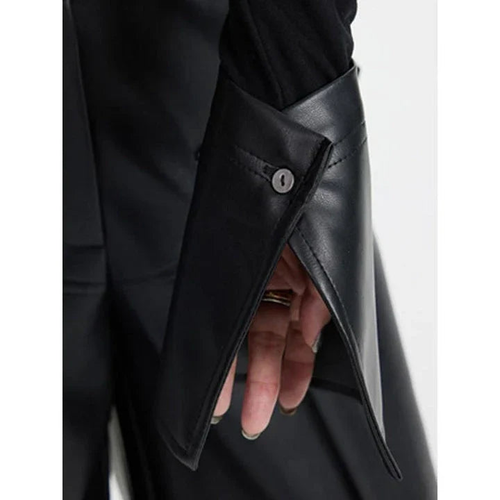 Stylish knit pullover with PU leather patchwork detail, offering a cozy and fashionable winter essential
