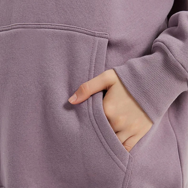 Cozy Fleece Hoodie and Sweatpants Set in Light Pink, featuring a relaxed fit and hooded design for maximum comfort and style.