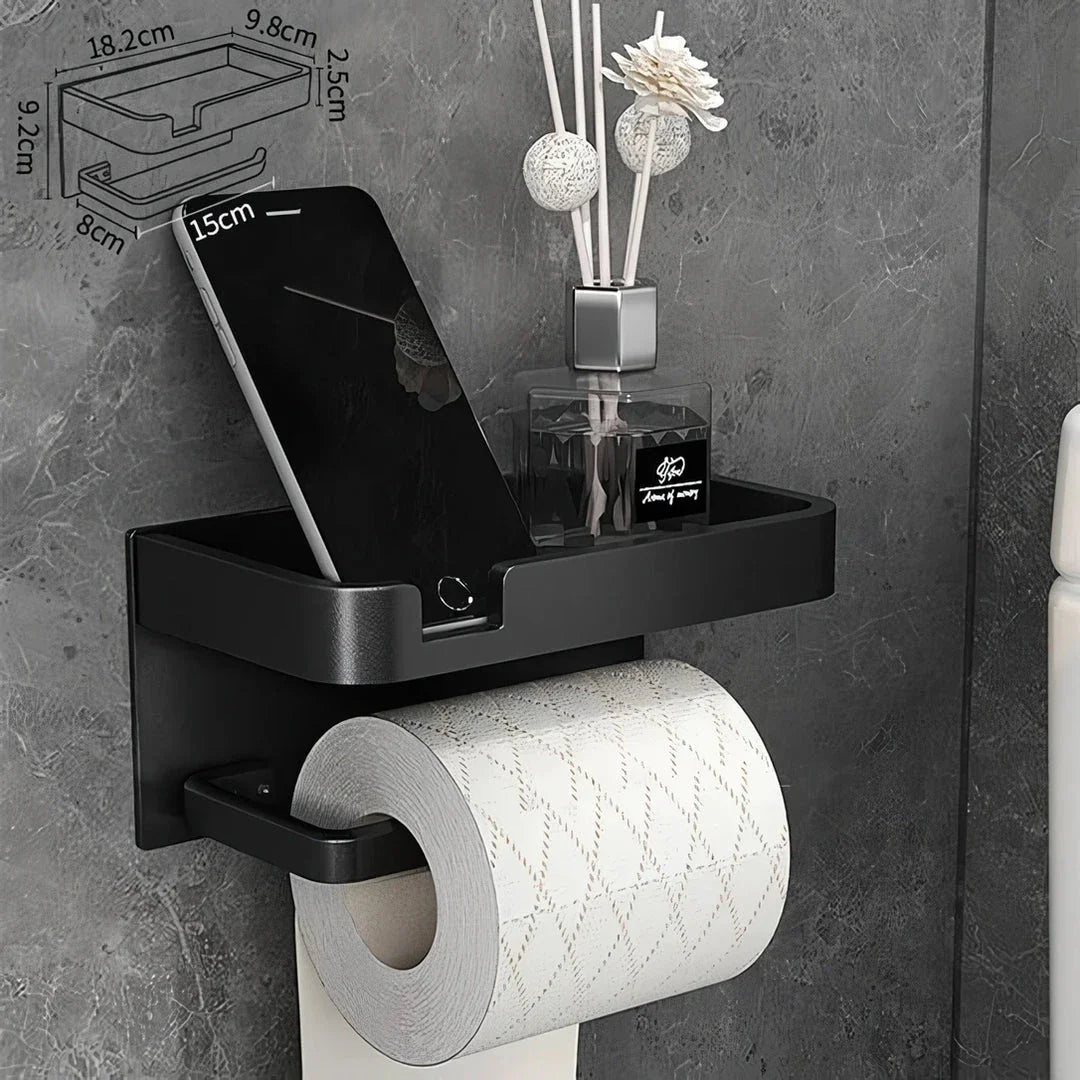 Black and gold aluminum bathroom paper holder with a convenient phone shelf, a stylish and functional accessory for modern bathrooms.