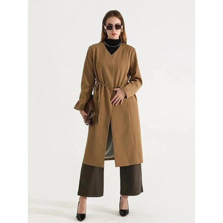 Women's full-length trench coat with lace-up waist, turn-down collar, and elegant full sleeves