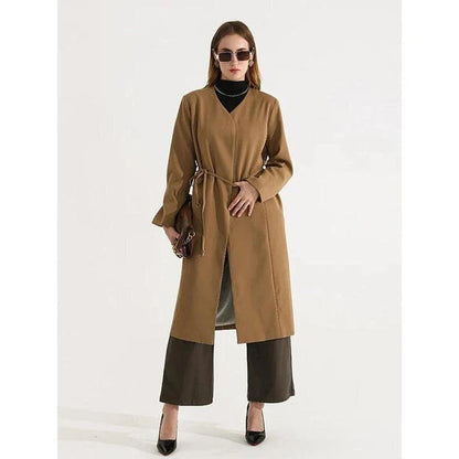 Women's full-length trench coat with lace-up waist, turn-down collar, and elegant full sleeves
