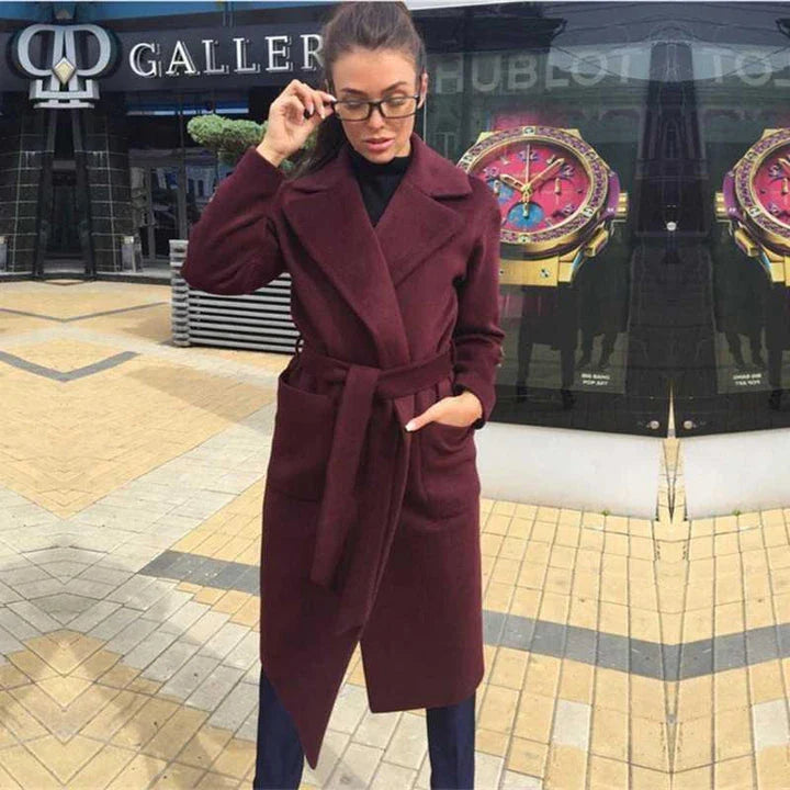 Navy blue woolen coat with a lapel tie accent, perfect for elevating any outfit