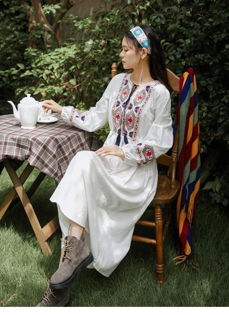 Elegant embroidered cotton-linen dress with tassels, featuring a waist-cinching A-line silhouette in vibrant colors