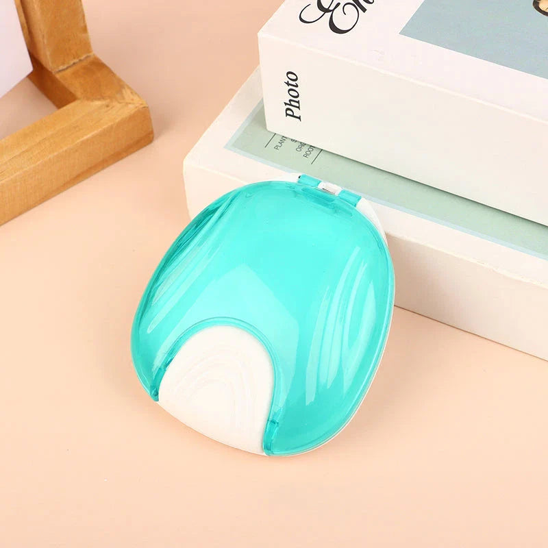 Compact, transparent dental retainer storage box with a push-to-open mechanism for easy access to dental appliances