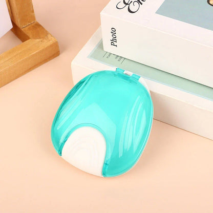 Compact, transparent dental retainer storage box with a push-to-open mechanism for easy access to dental appliances