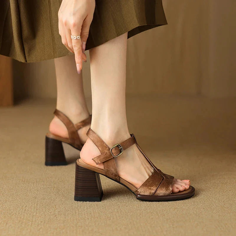 Genuine leather gladiator sandals with chunky heel, open-toe design, and secure buckle strap closure for summer style