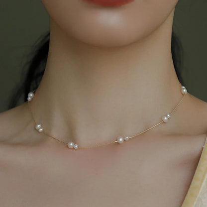 Elegant mother-of-pearl necklace with delicate butterfly and dragonfly motifs, inspired by Asian design