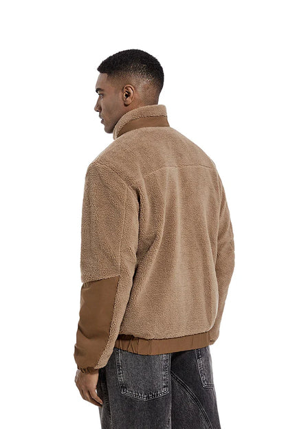 A cozy and stylish men's fleece jacket with a standing collar and convenient side pockets, available in a range of classic colors.