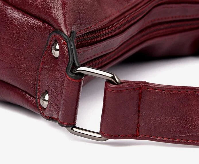 Stylish one-shoulder messenger bag in various colors with a soft, supple PU leather exterior and a spacious, organized main compartment