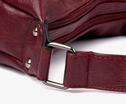 Stylish one-shoulder messenger bag in various colors with a soft, supple PU leather exterior and a spacious, organized main compartment