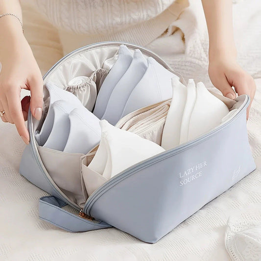 Compact travel underwear and lingerie organizer bag made of durable polyester for organized storage of bras, underwear, and socks while on the go.