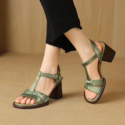 Genuine leather gladiator sandals with chunky heel, open-toe design, and secure buckle strap closure for summer style