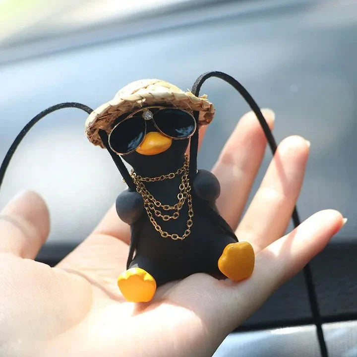 Cute swinging duck car pendant with a guitar and coke-themed design, adding a touch of personality to your vehicle
