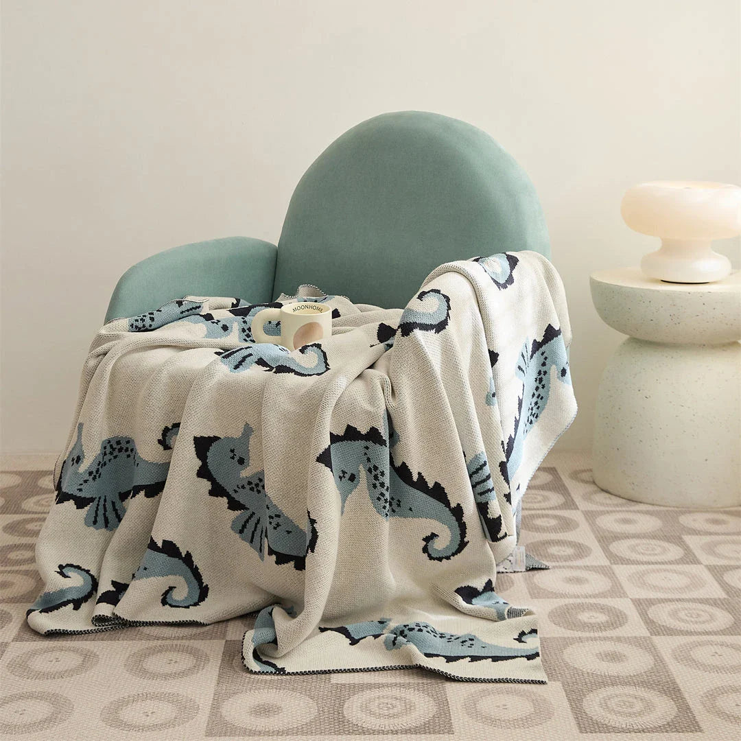 Cozy cotton blanket with cute sea horse design, perfect for relaxation and comfort