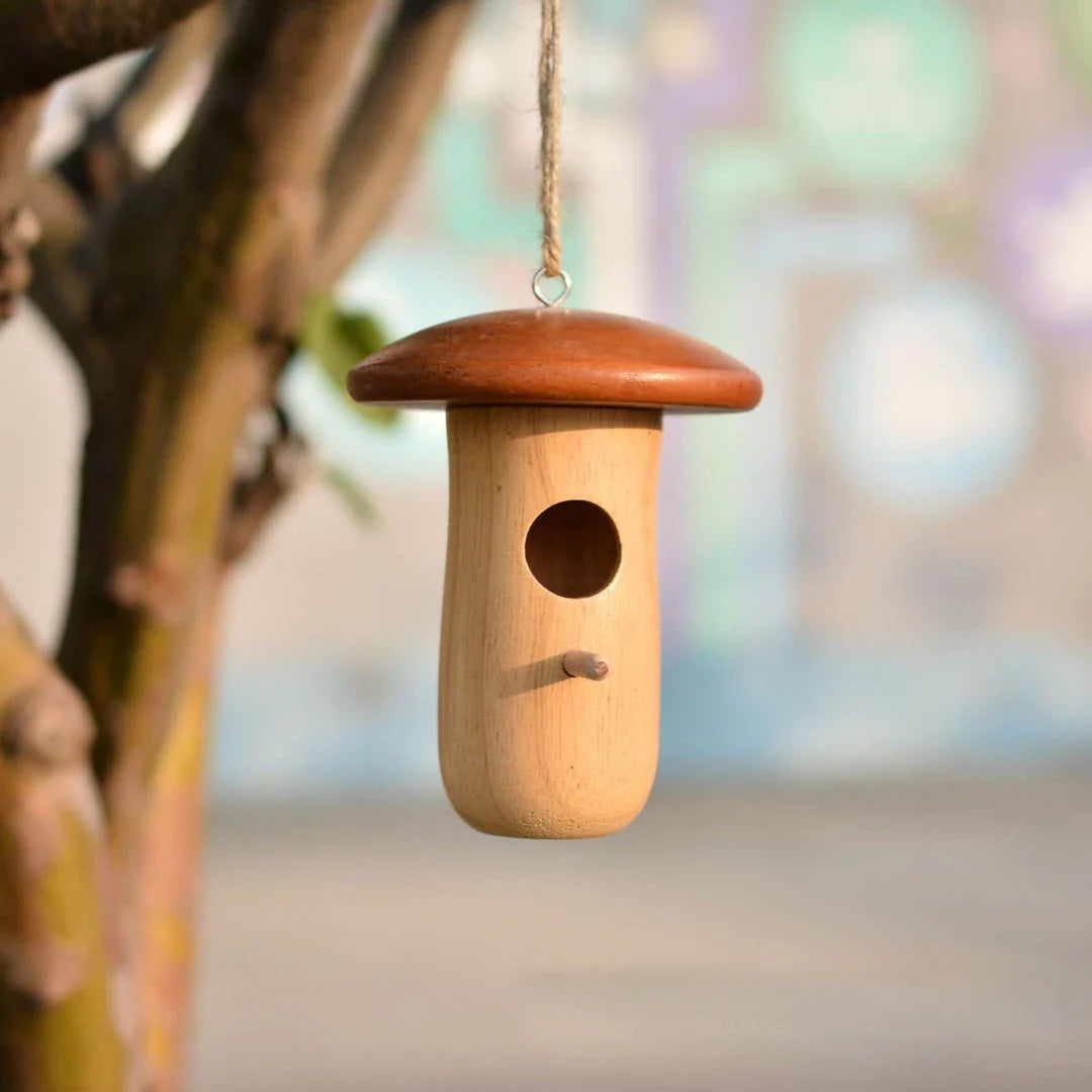 A decorative wooden hummingbird nest with a classic rustic design, perfect for attracting and providing a cozy retreat for hummingbirds in your outdoor garden.