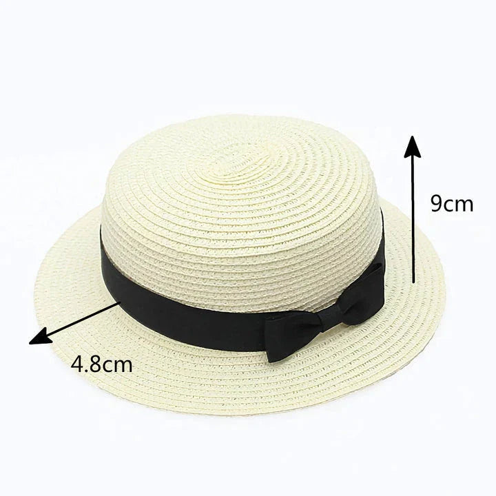 Classic straw Panama hat with a bow detail, offering sun protection and fashionable summer style