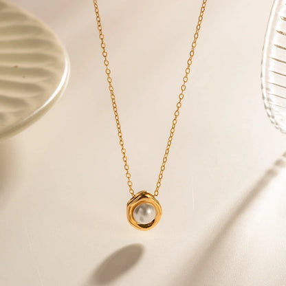 Elegant stainless steel pearl pendant necklace with a geometric design, perfect for women's fashion and everyday style.