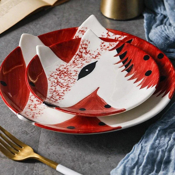 Charming ceramic plate with whimsical animal patterns, available in small and large sizes, perfect for serving meals and snacks.